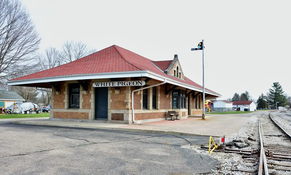 White Pigeon Train Depot Exterior by Railroad Tracks Exterior of the White Pigeon Train Depot next to railroad tracks